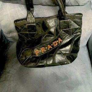 Used Prada leather purse. In excellent condition.